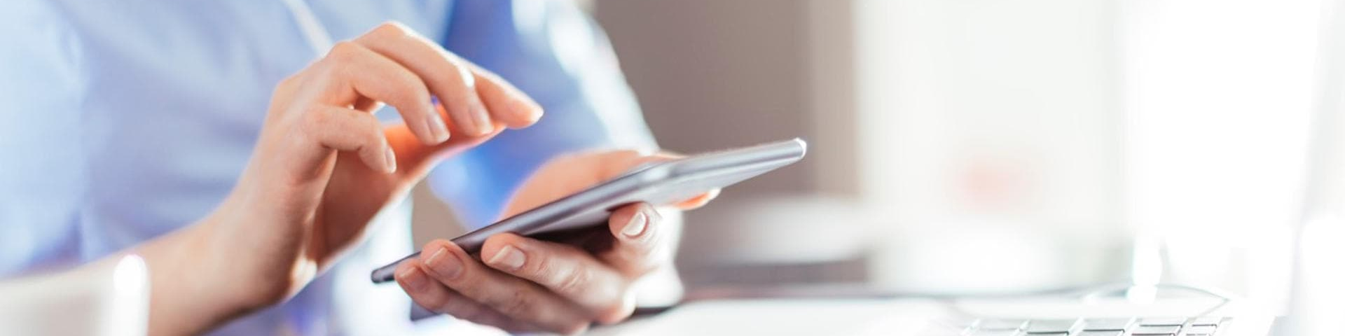 Woman using a tablet to analyze investments